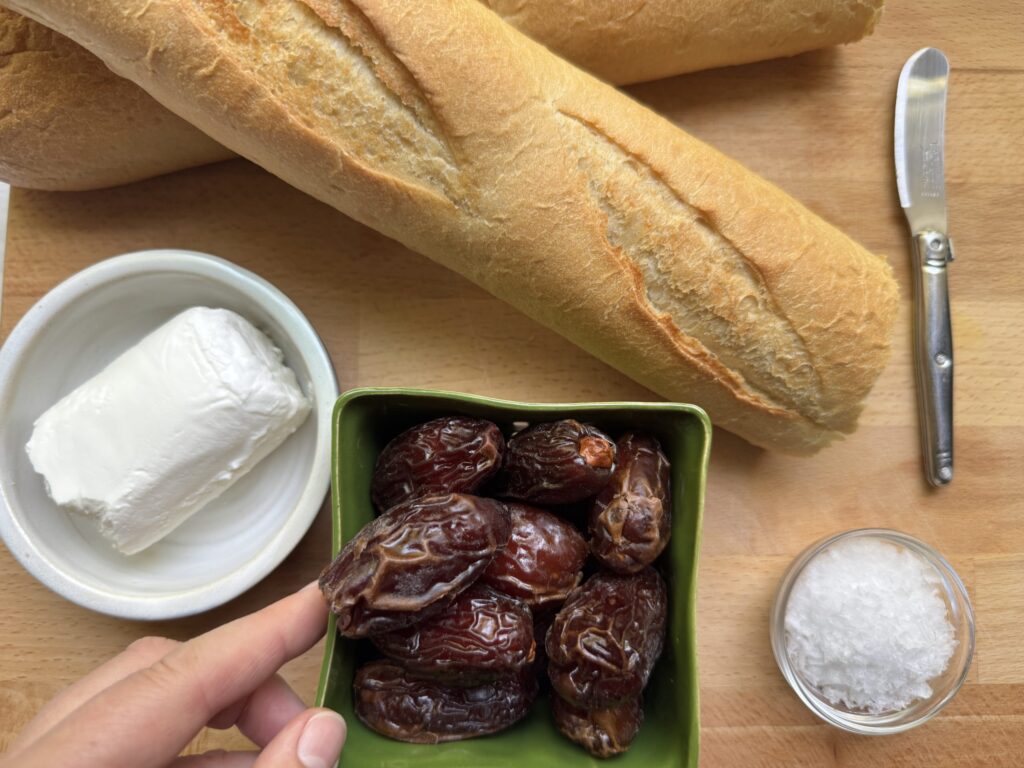 Baguette, goat cheese, dates, and flaky salt.