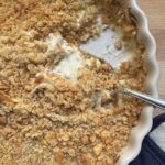 Finished casserole with serving spoon.