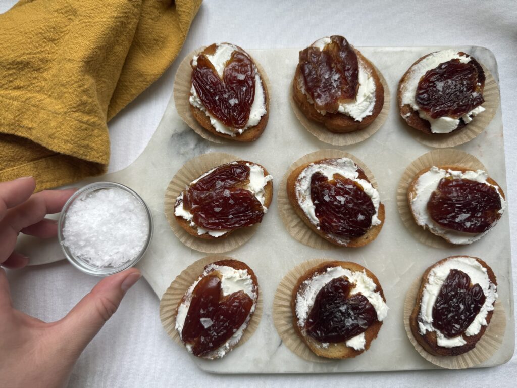 Crostini with goat cheese, dates, and flaky sea salt.