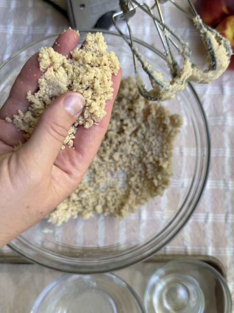 Crumble topping demonstration for desired texture.