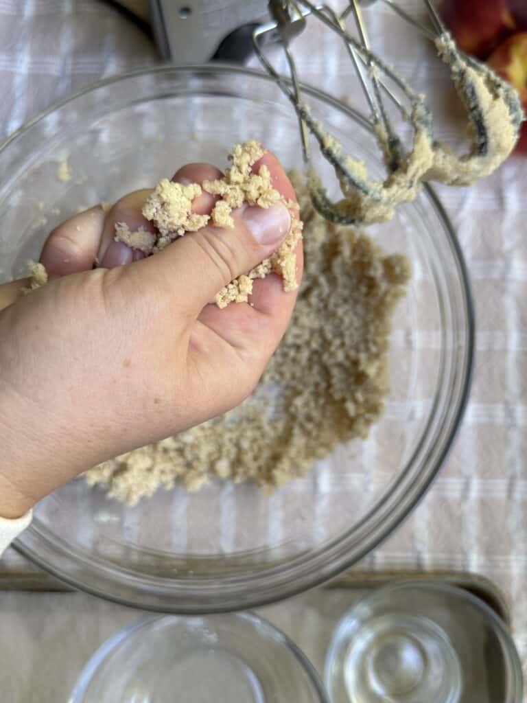 Crumble topping demonstration for desired texture.