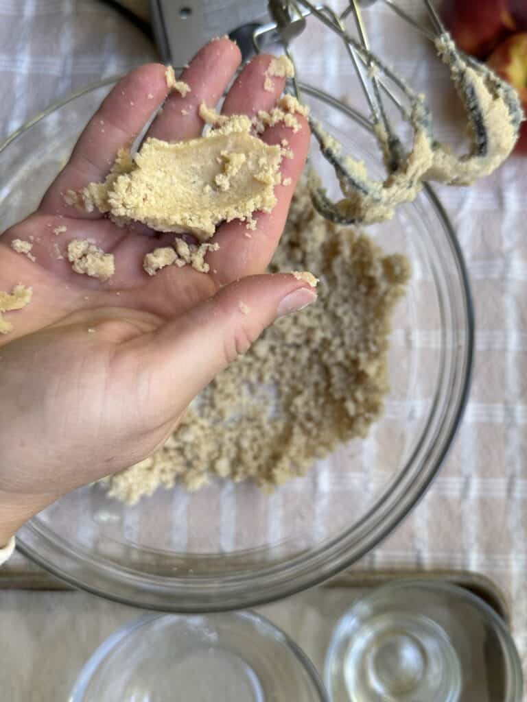Crumble topping demonstration for desired texture.