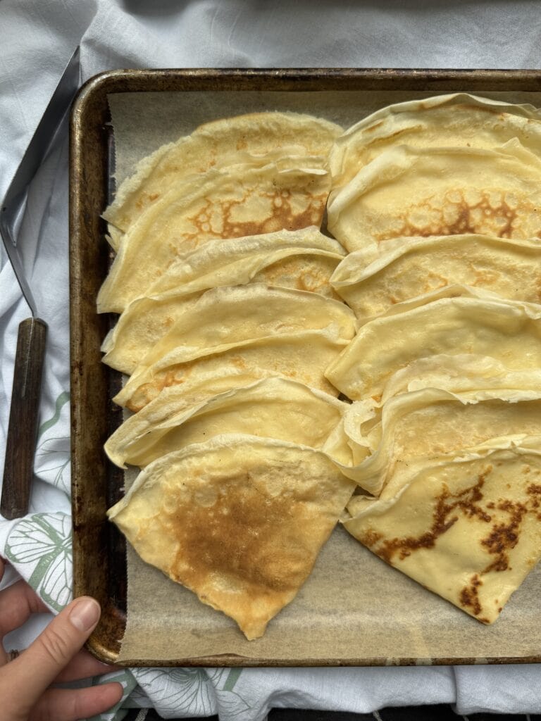 Finished pan of folded crepes, ready to serve.