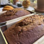 Fresh pumpkin bread loaves, still in the pan.