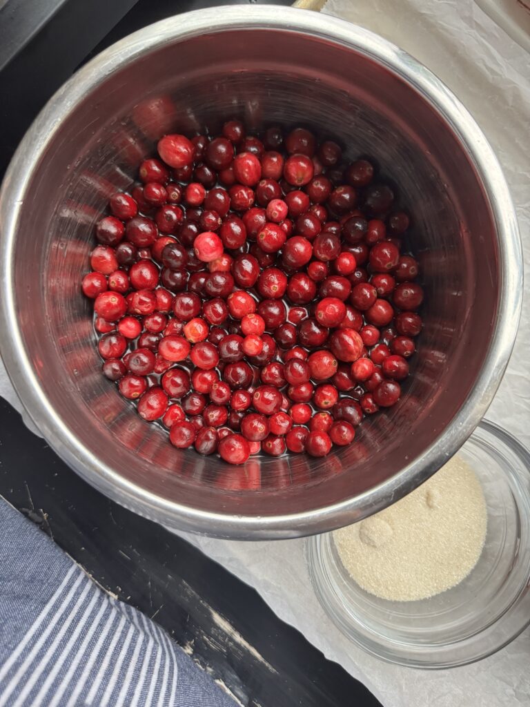 Cranberries soaking in sugar-liqueur syrup.
