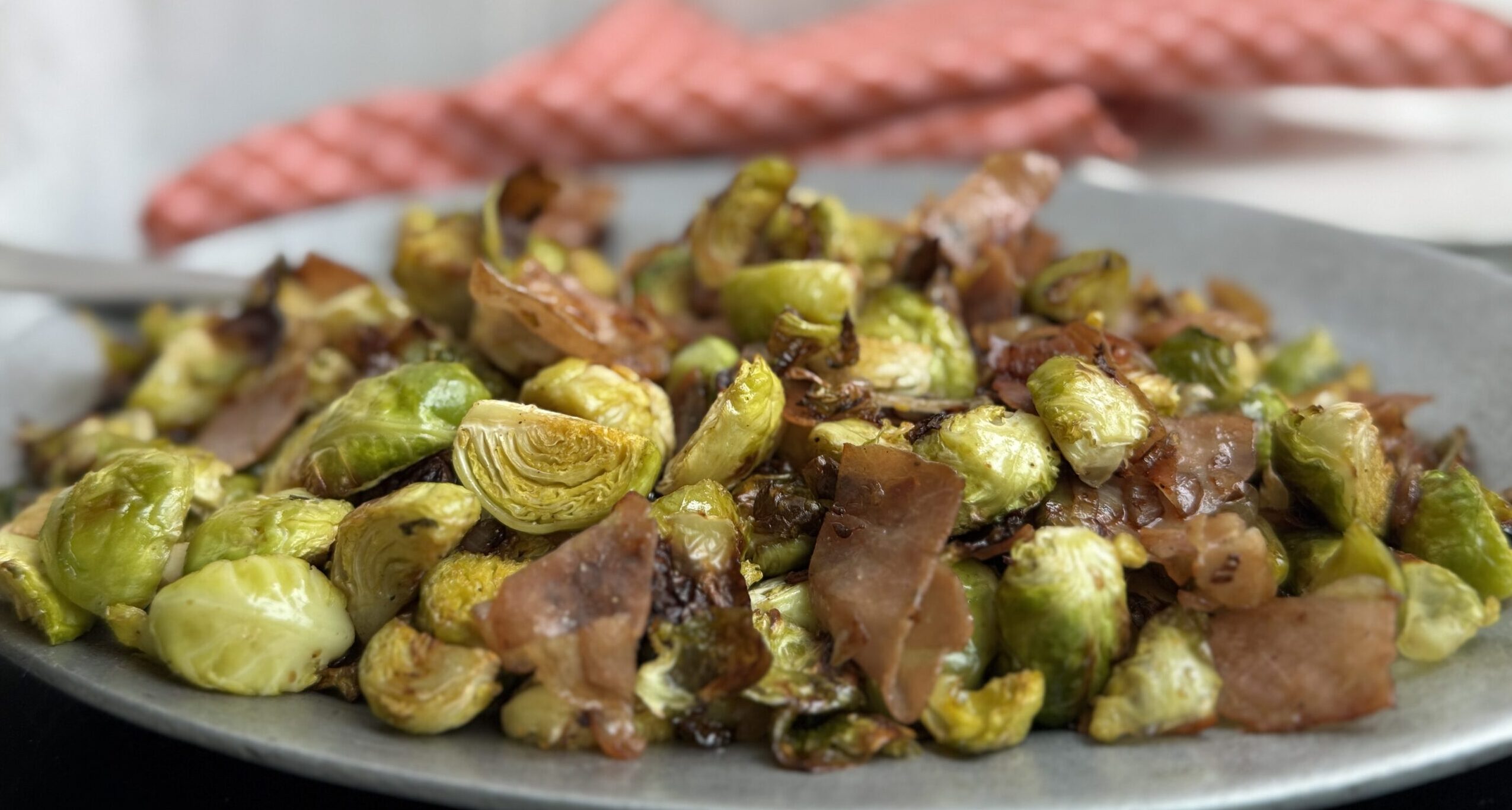 Plated Brussels Sprouts with Prosciutto and Shallots.
