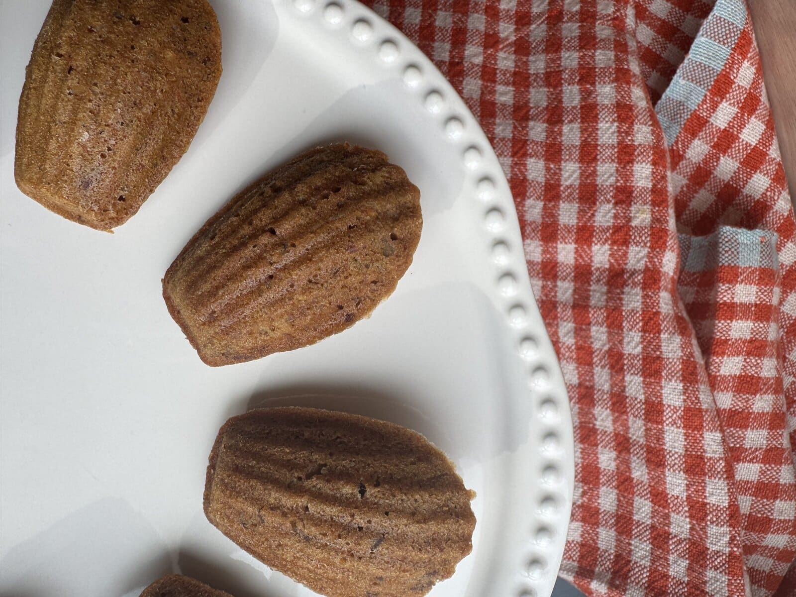 brown butter carrot cake madeleines on serving plate