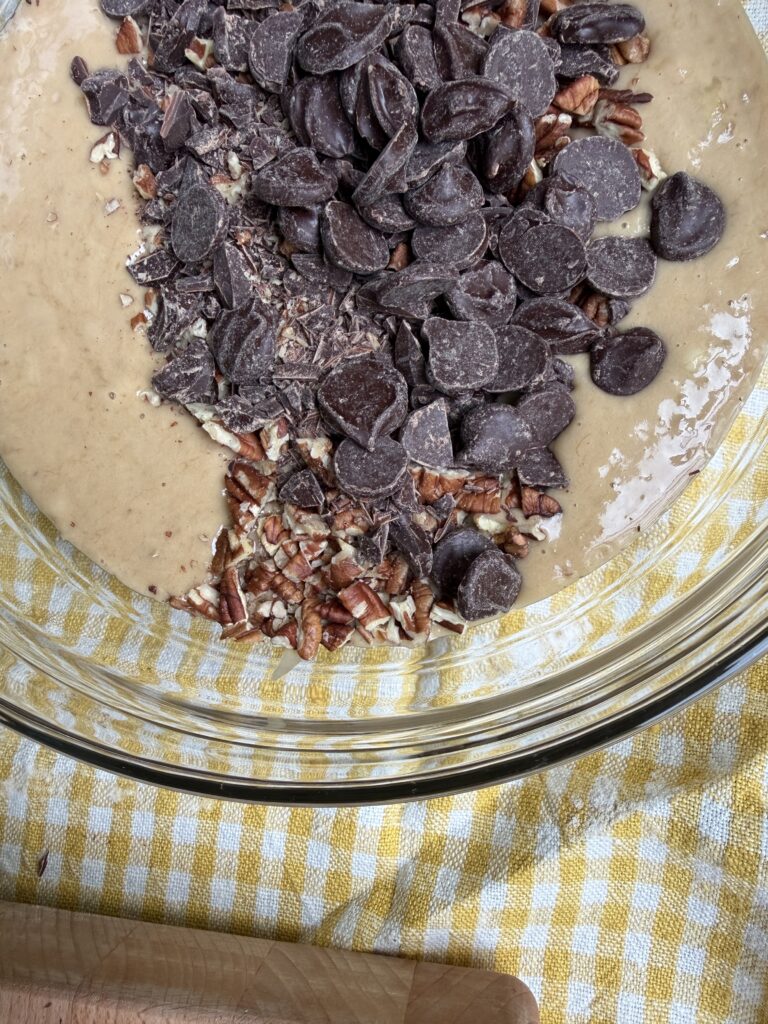 Chopped pecans and chocolate added to the banana bread batter