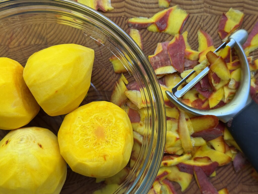Golden beets peeled in a glass bowl