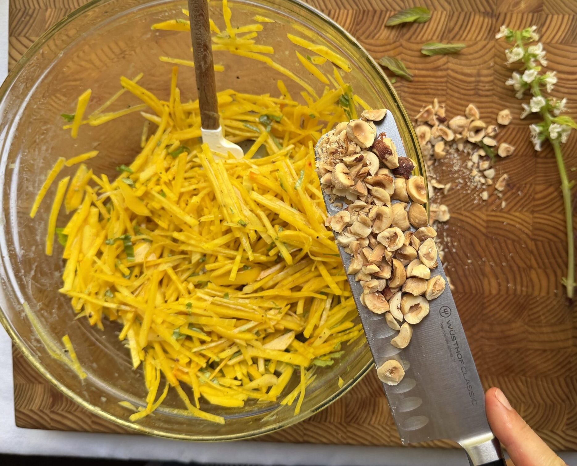 Raw golden beet slaw with hazelnuts added in