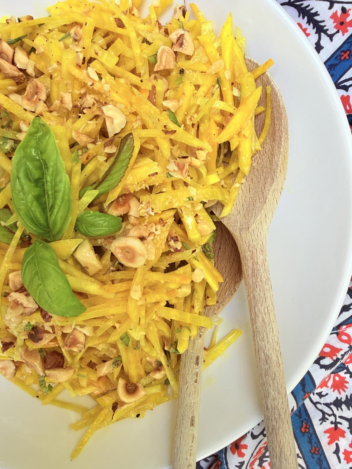 Raw golden beet salad with basil, mint, and toasted hazelnuts