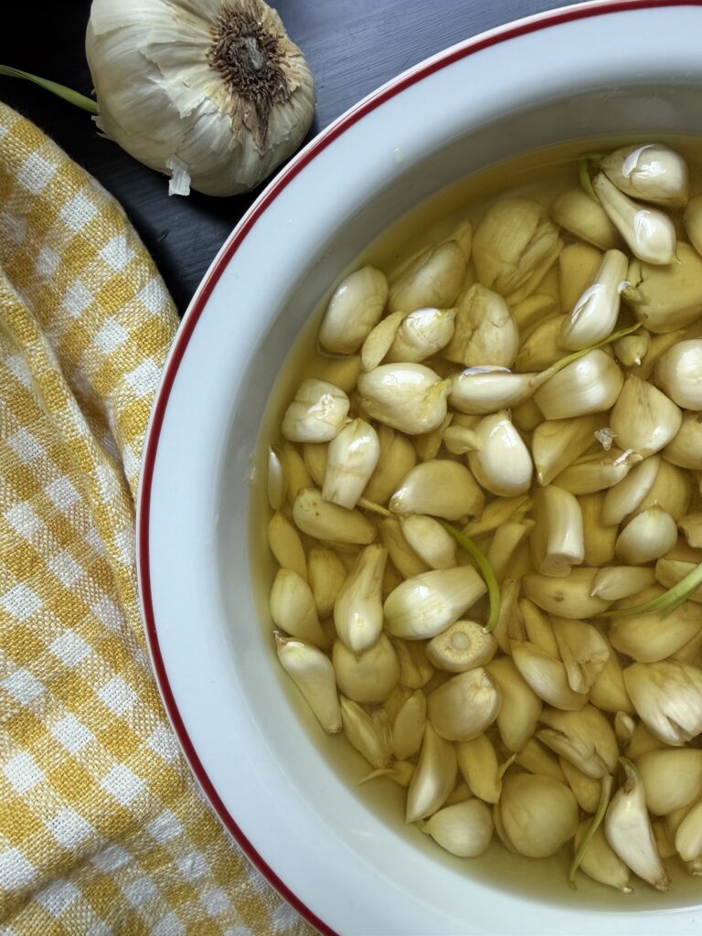 Garlic in olive oil, ready to bake