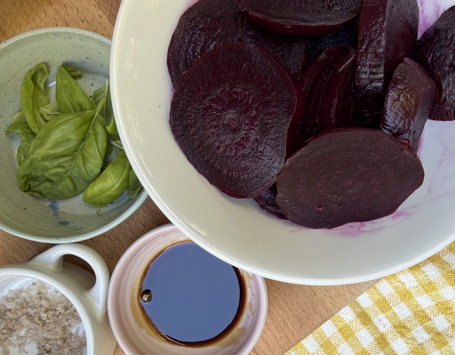 Roasted beets with serving ingredients (basil, flaky salt, black pepper, olive oil)