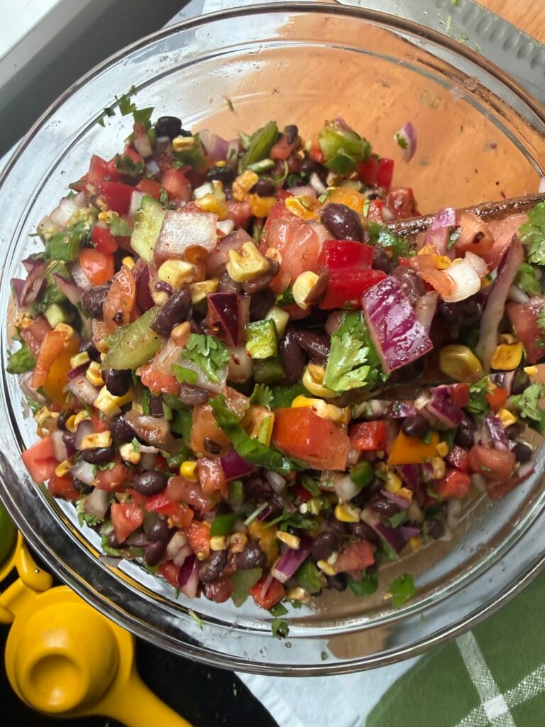 Black bean and corn salsa in a clear bowl, ready to serve.